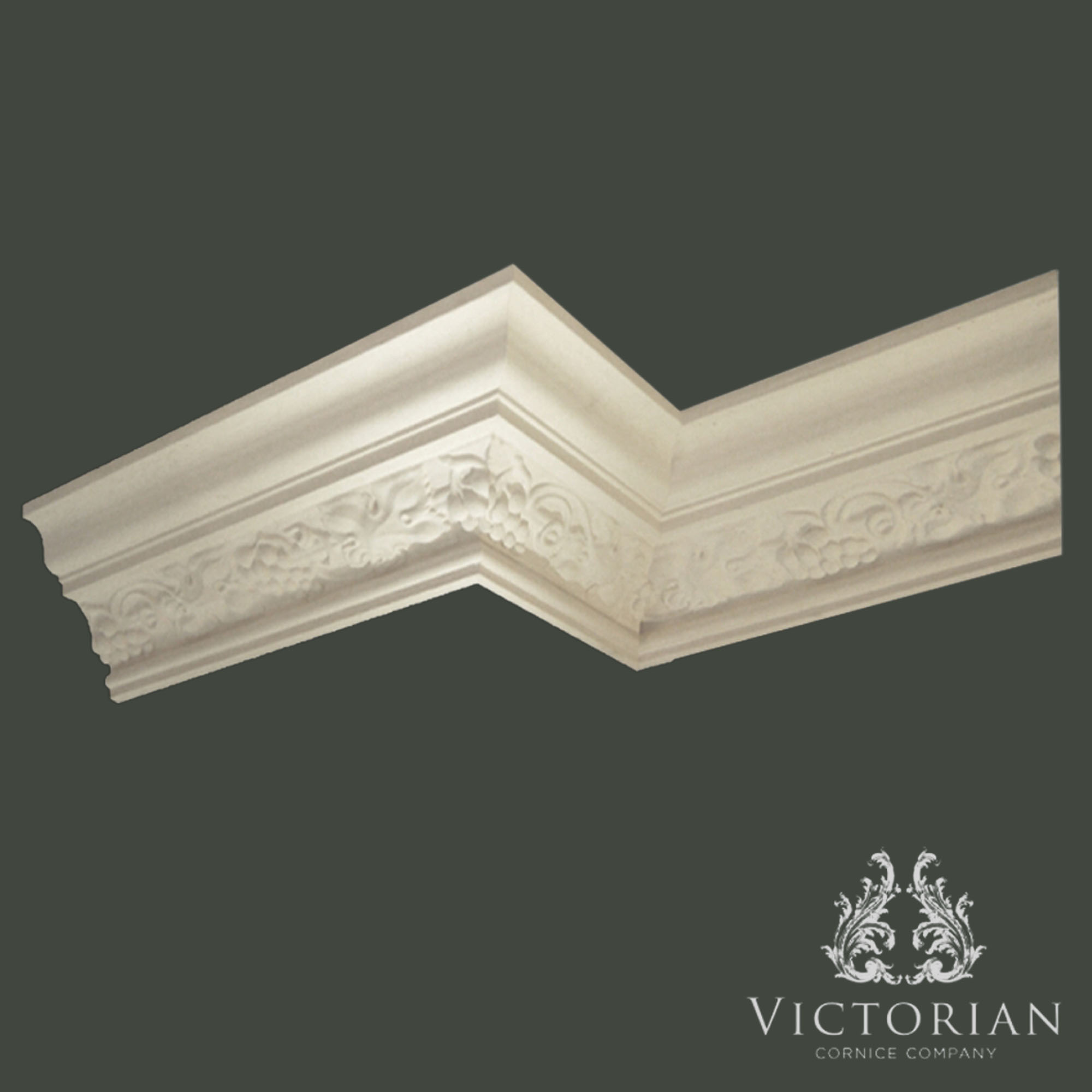 C101 decorative plaster cornice with grape and vine enrichment, featuring detailed fruit and foliage motifs within a classical moulded profile.