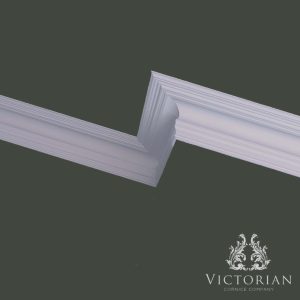 C124 swan neck plaster cornice installed in a room setting, showcasing elegant curves and traditional period detailing.