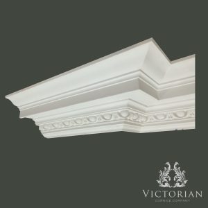 C142 egg and dart plaster cornice installed on an external corner, highlighting its decorative classical enrichment and substantial period profile.
