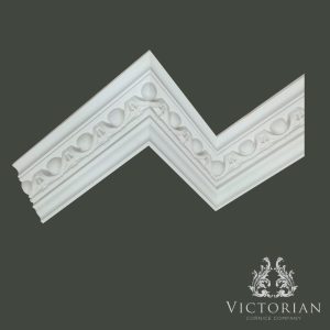 C143 Egg and Dart Plaster Cornice Installed C143 egg and dart plaster cornice installed on an internal corner, showcasing detailed classical egg and dart enrichment and crisp traditional moulding lines.