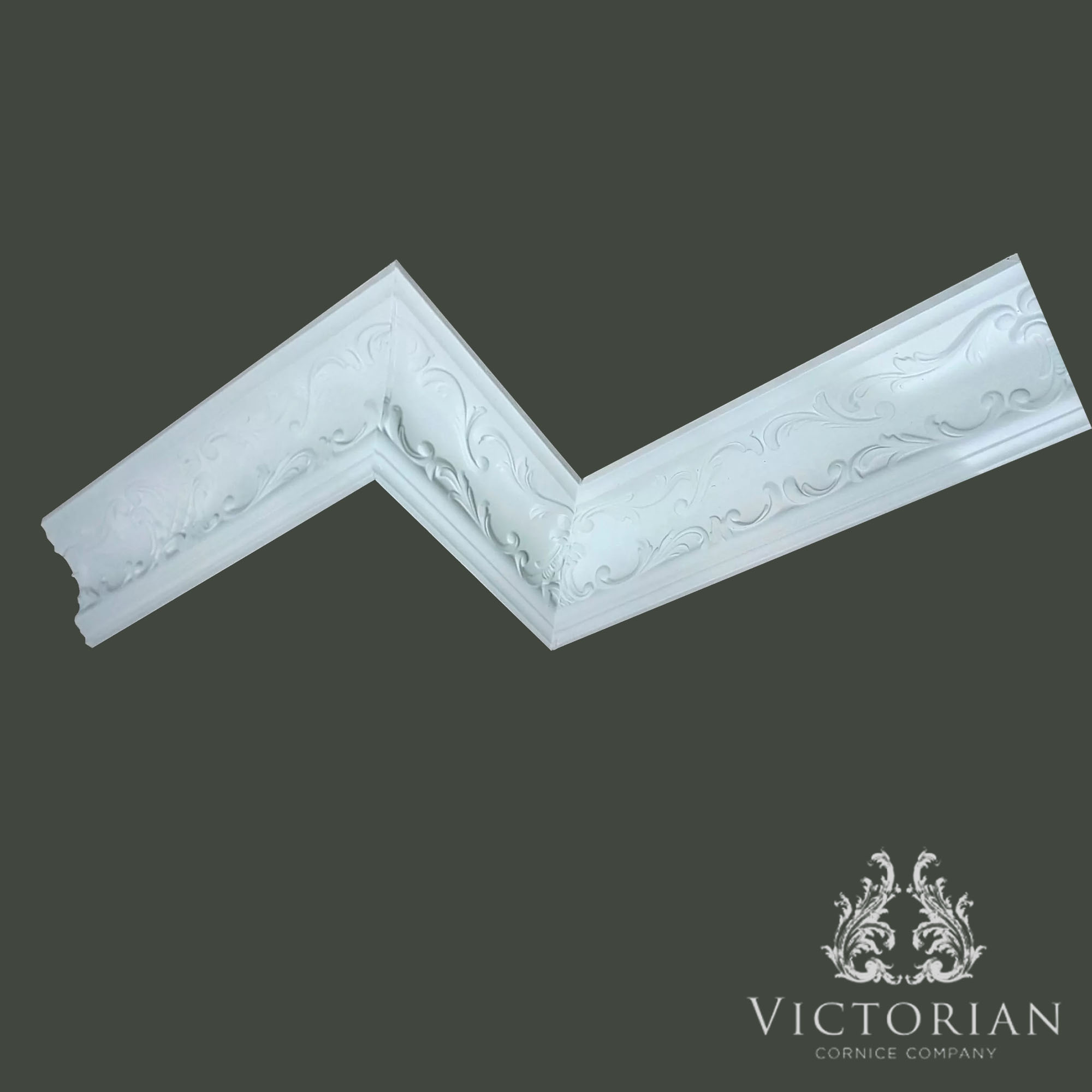C167 Rococo plaster cornice featuring intricate scrolling foliage and flowing ornamental details, displayed from an angled perspective to showcase its decorative relief.