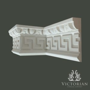 Decorative Greek key plaster cornice with classical geometric pattern and dentil-style upper detailing