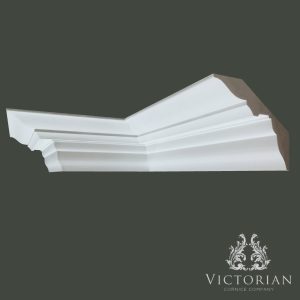 Traditional stepped plaster cornice with smooth curved profile and layered detailing