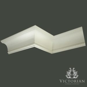 C38 plaster cornice with smooth cavetto curve and subtle rope detailing along the lower edge