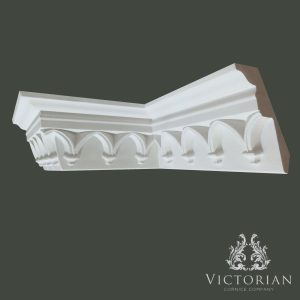 Gothic style plaster cornice with decorative pointed arch detailing and traditional architectural profile