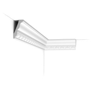 C212 Orac Purotouch cornice installed in a room corner with classic egg-and-dart detailing and a traditional stepped profile.