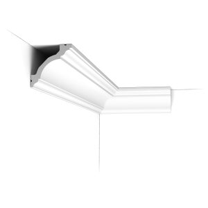 C213 Orac Purotouch cornice installed in a room corner, showing a stepped and curved traditional profile.