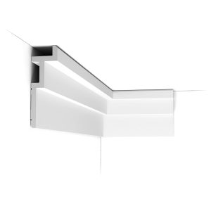 ORAC C396 contemporary cornice installed at the wall and ceiling junction, featuring a bold angular profile with integrated space for concealed LED lighting.