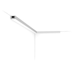 Installed corner view of the CX190 Orac duropolymer uplighter cornice showing a slim, linear profile designed for concealed LED lighting.