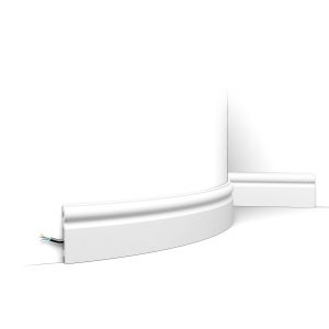 Flexible ogee skirting board fitted to curved wall with concealed cable channel