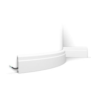 Flexible modern skirting board fitted to curved wall with concealed cable channel
