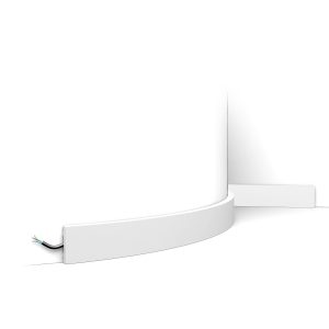 Flexible skirting board with soft edge fitted to curved wall with concealed cable channel