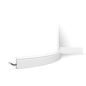 Flexible skirting board with rounded top detail fitted to curved wall with concealed cable channel