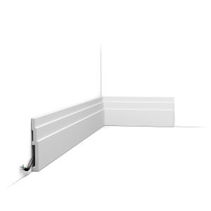 Orac SX180 skirting board installed with stepped detail and cable management