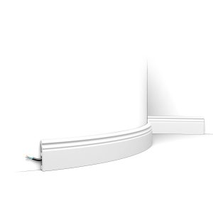 Flexible skirting board with double line detail fitted to curved wall with concealed cable channel