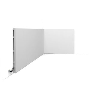 Orac SX207 skirting board installed on wall showing tall plain modern profile