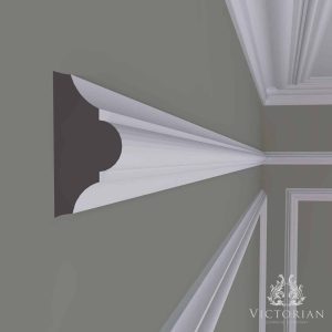 P18 handmade plaster dado rail installed on an interior wall with decorative panel mouldings in a traditional setting.