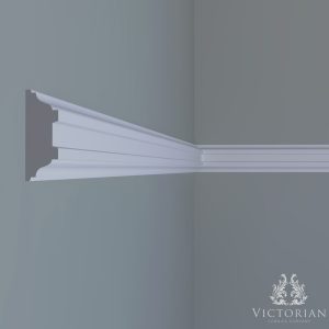 P35 handmade plaster dado rail installed on an interior wall with decorative panel mouldings in a traditional setting.