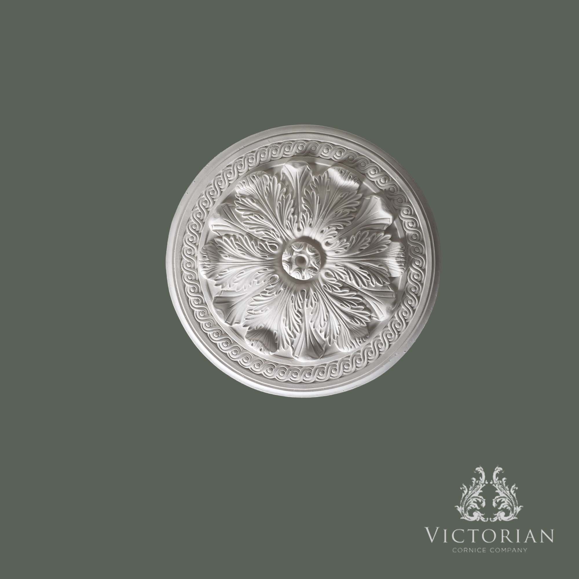 Front view of the R17 handmade plaster ceiling rose featuring deeply carved acanthus leaves, a decorative Greek key border and central fixing point.