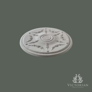 Side profile of the R23 handmade plaster ceiling rose showing its shallow projection, delicate floral garland detailing, and fine rope border.
