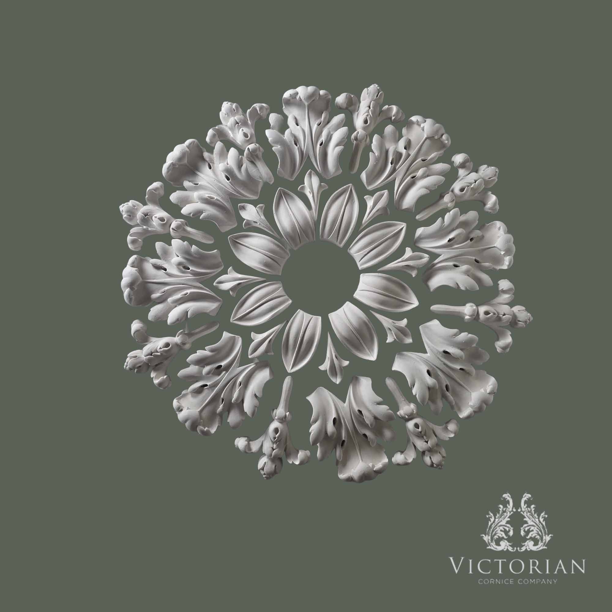 Exploded view of the R28 multi-piece plaster ceiling rose showing the individual handcrafted sections before installation.