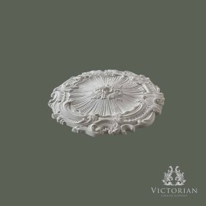 Side profile of the R29 handmade plaster ceiling rose showing its decorative Rococo scrollwork, shallow projection, and finely detailed sunburst centre.