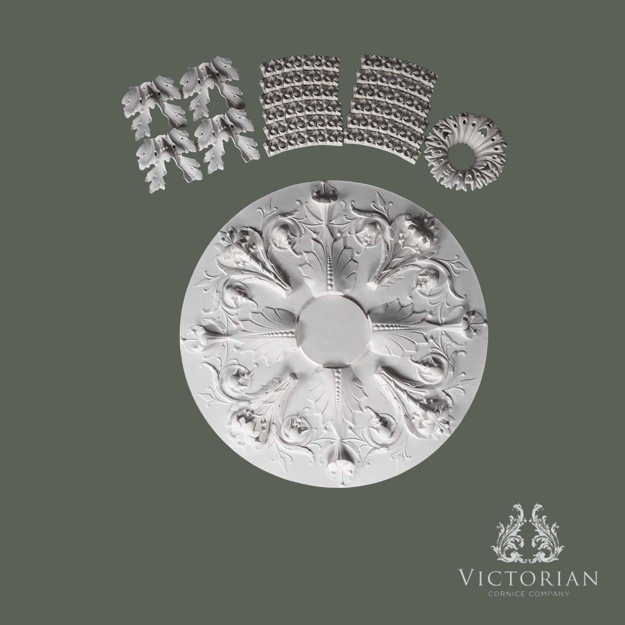 Exploded view of the R37 multi-piece plaster ceiling rose showing the individual handcrafted sections before assembly.