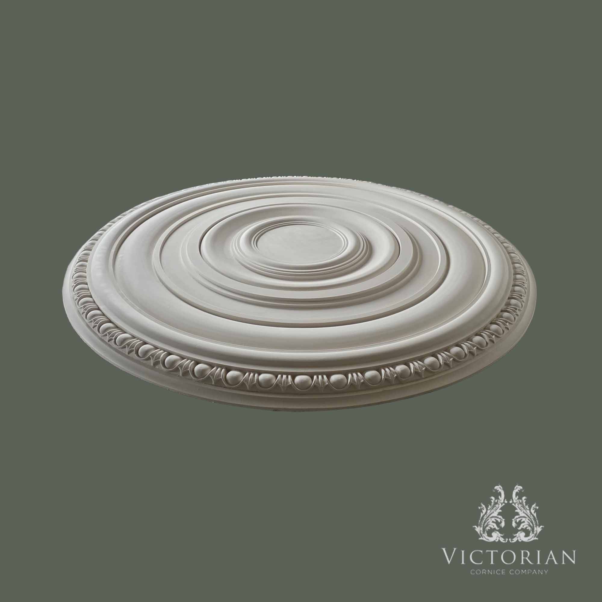 Side profile of the R46 handmade plaster ceiling rose showing its stepped concentric design, egg and dart border and shallow projection.
