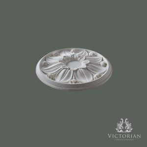 Side profile of the R50 handmade plaster ceiling rose showing its raised floral centre, layered petals and shallow projection.