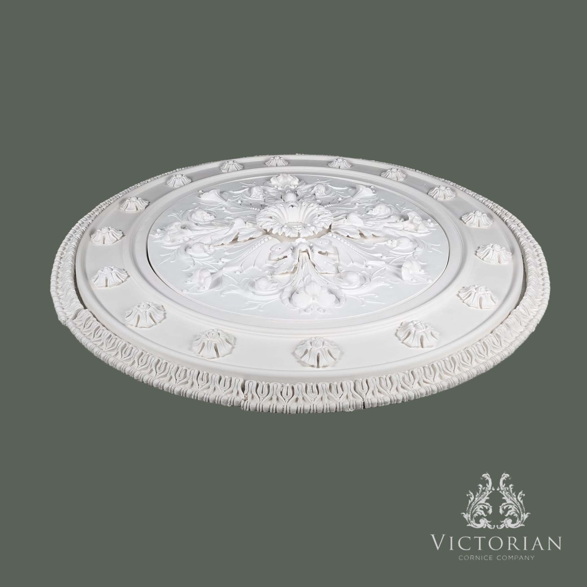Side profile of the R53 multi-piece plaster ceiling rose showing its raised acanthus centre, moulded outer band and layered construction.