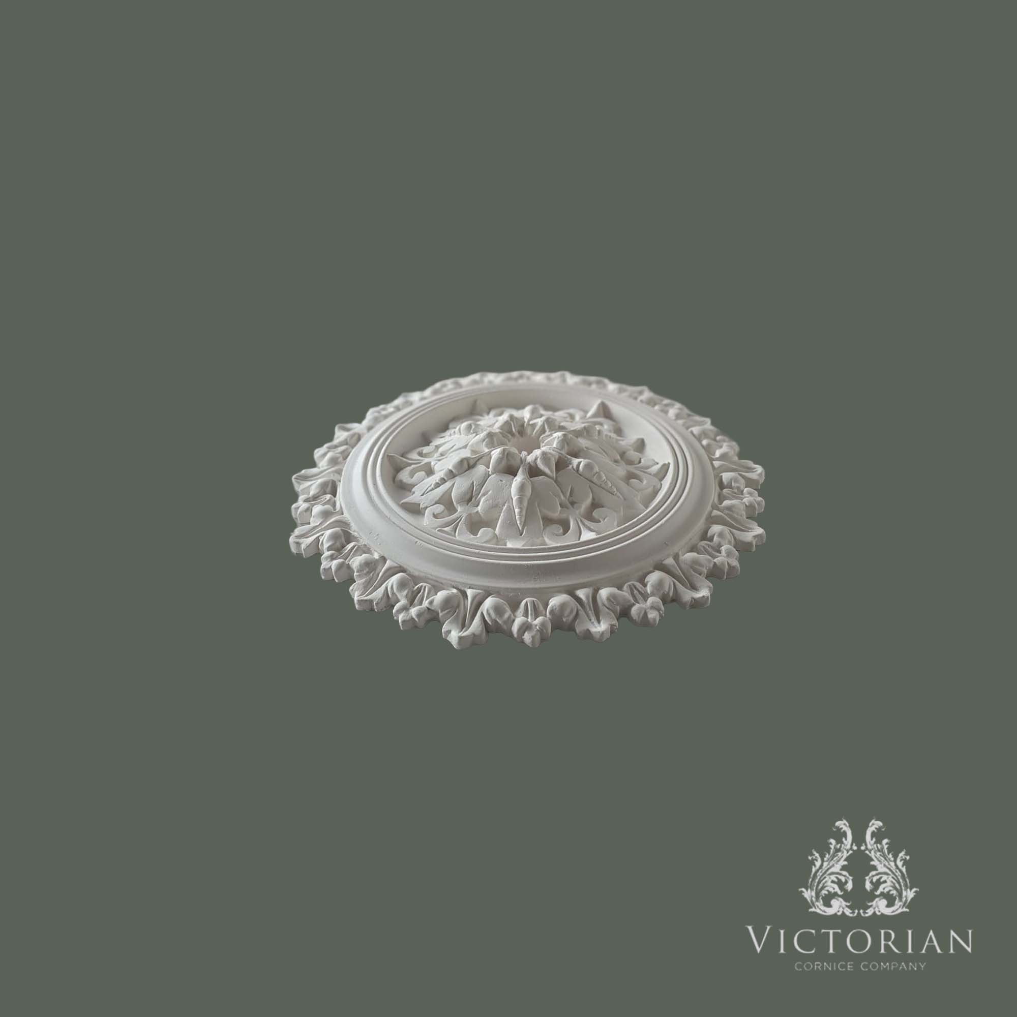 Side profile of the R54 handmade plaster ceiling rose showing its raised acanthus leaf centre and decorative outer leaf border.