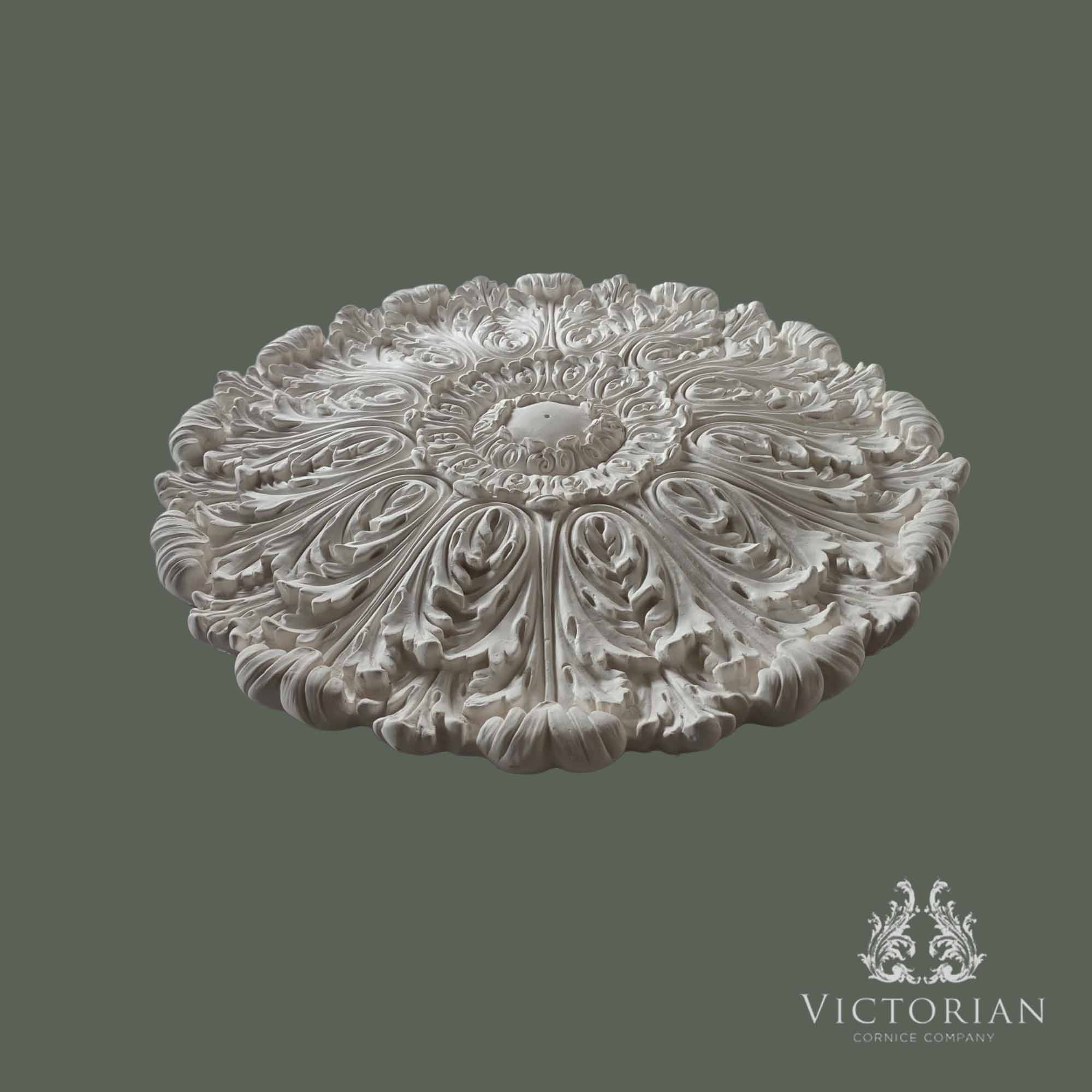 Side profile of the R69 plaster ceiling rose showing its deep projection, intricate acanthus leaf detailing and handcrafted Victorian finish.