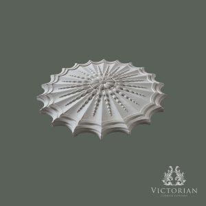 Side profile of the R71 handmade plaster ceiling rose showing its scalloped edge, radiating bead detailing and raised floral centre.