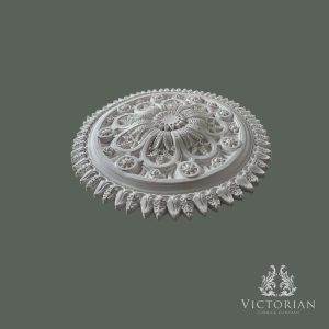 Side profile of the R76 handmade plaster ceiling rose showing its raised floral centre, deep relief detailing, and decorative leaf border.