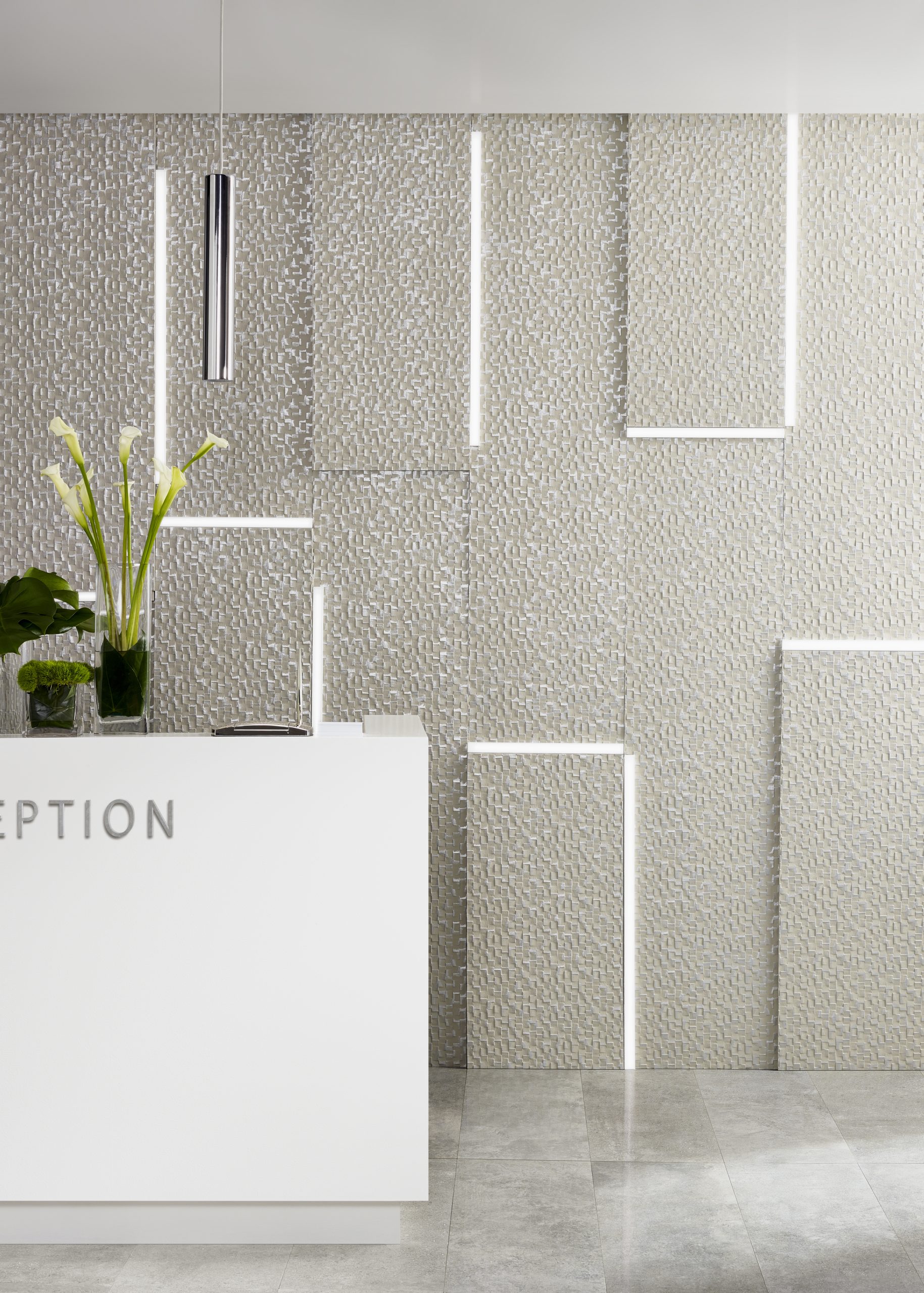 Modern commercial interior featuring textured Lincrusta Checkers wallcovering with geometric panel installation