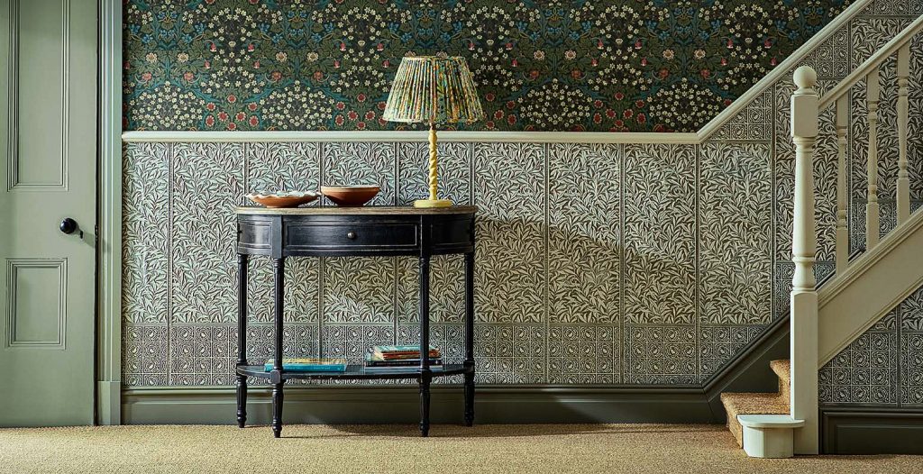 Lincrusta wallcovering installed in staircase hallway with embossed decorative panels