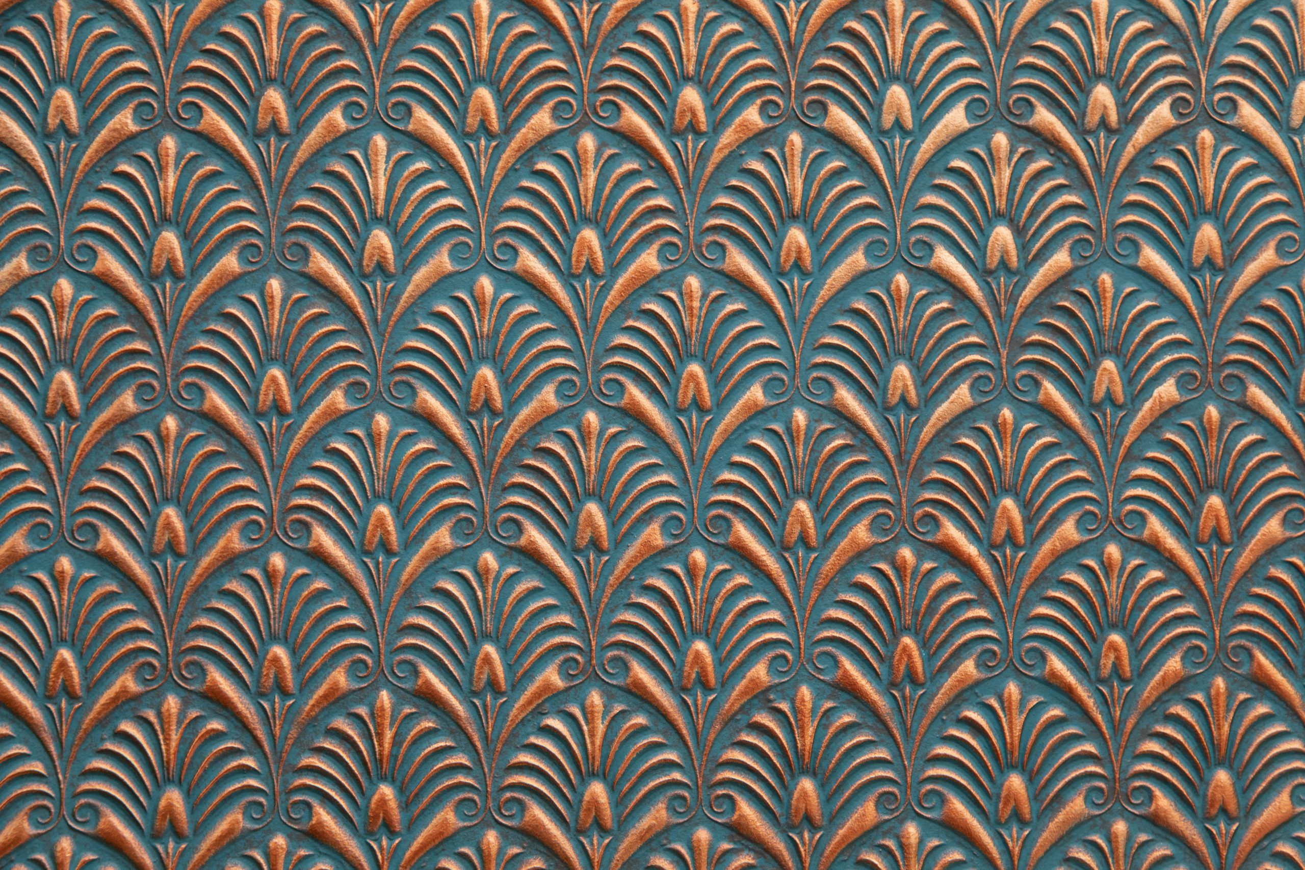 Lincrusta embossed wallcovering with metallic Art Deco fan motif in teal and copper tones