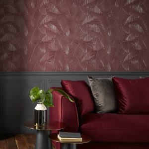 Lincrusta Palm Wallcovering – Embossed Tropical Leaf Design Luxury interior featuring embossed Lincrusta palm leaf wallcovering in rich burgundy tones
