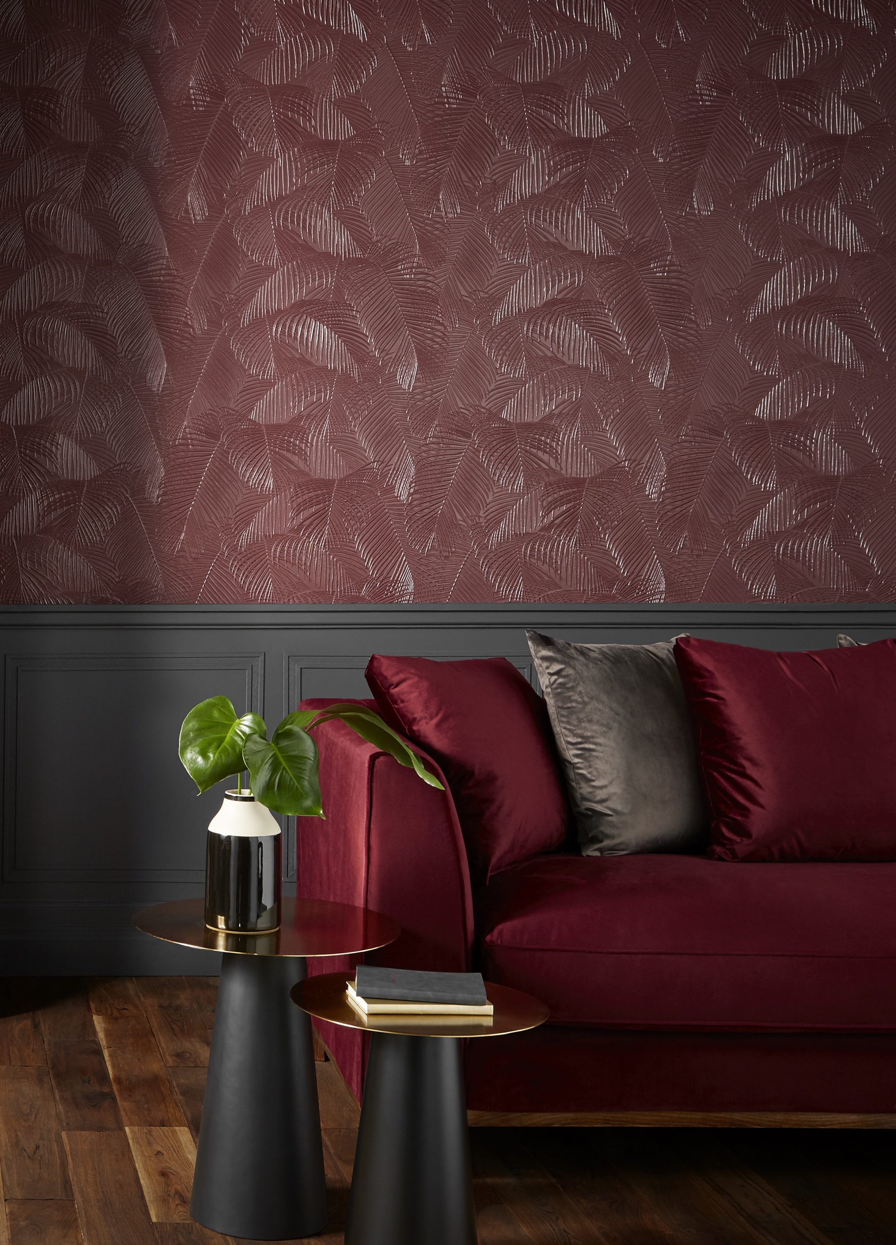 Luxury interior featuring embossed Lincrusta palm leaf wallcovering in rich burgundy tones