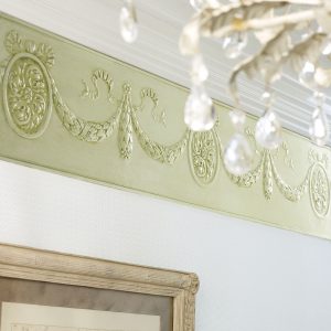 Lincrusta RD1948FR Cameo Frieze installed beneath decorative plaster cornice in a traditional interior