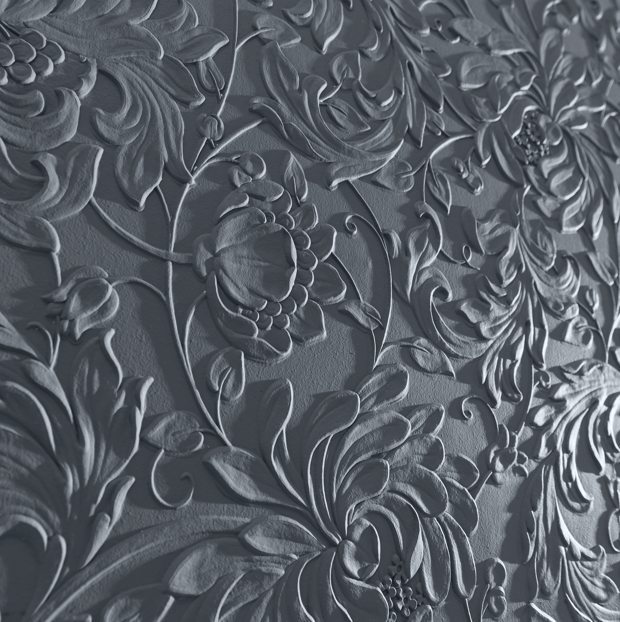Close-up of Lincrusta Kelmscott embossed floral wallcovering with deep textured detailing