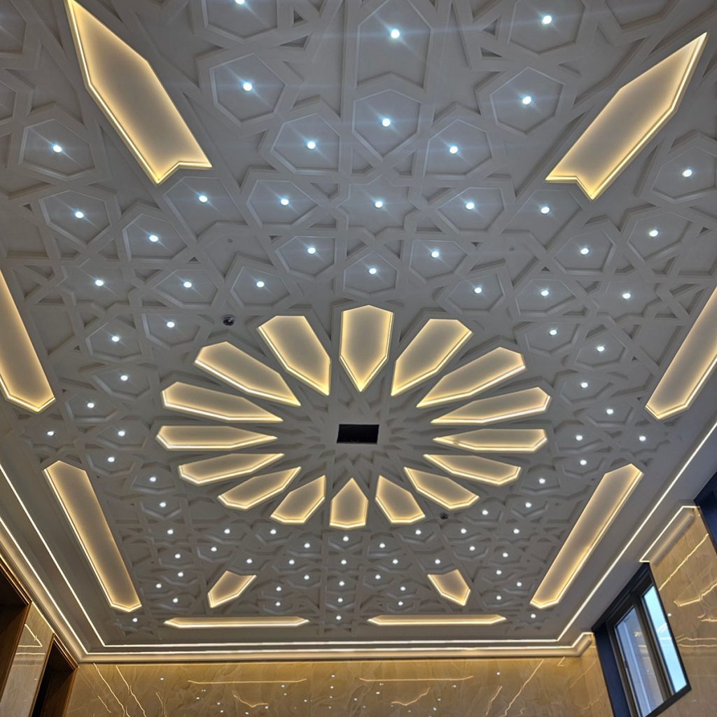 Bespoke plaster ceiling with geometric pattern and integrated LED lighting, expertly designed and installed in a high-end interior
