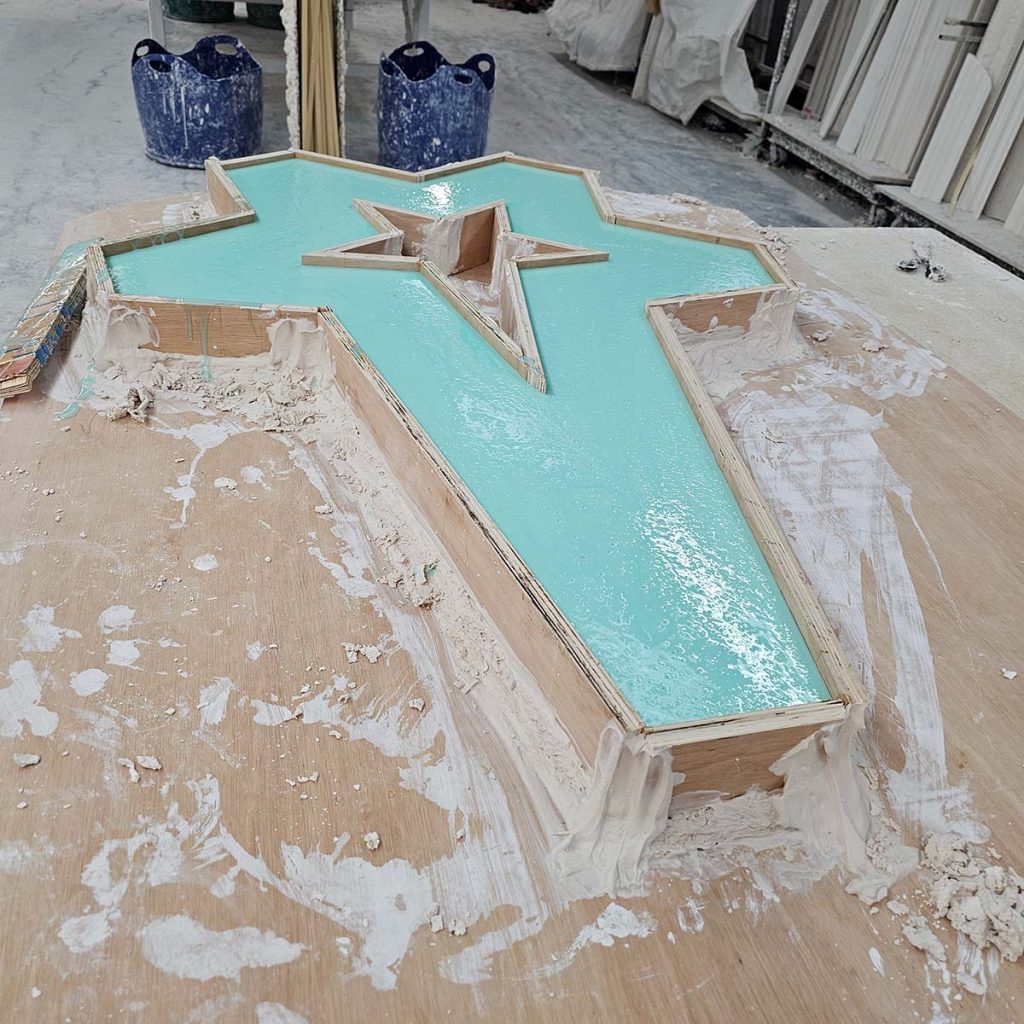 Bespoke plaster mould being created in workshop using hand-built form and casting materials