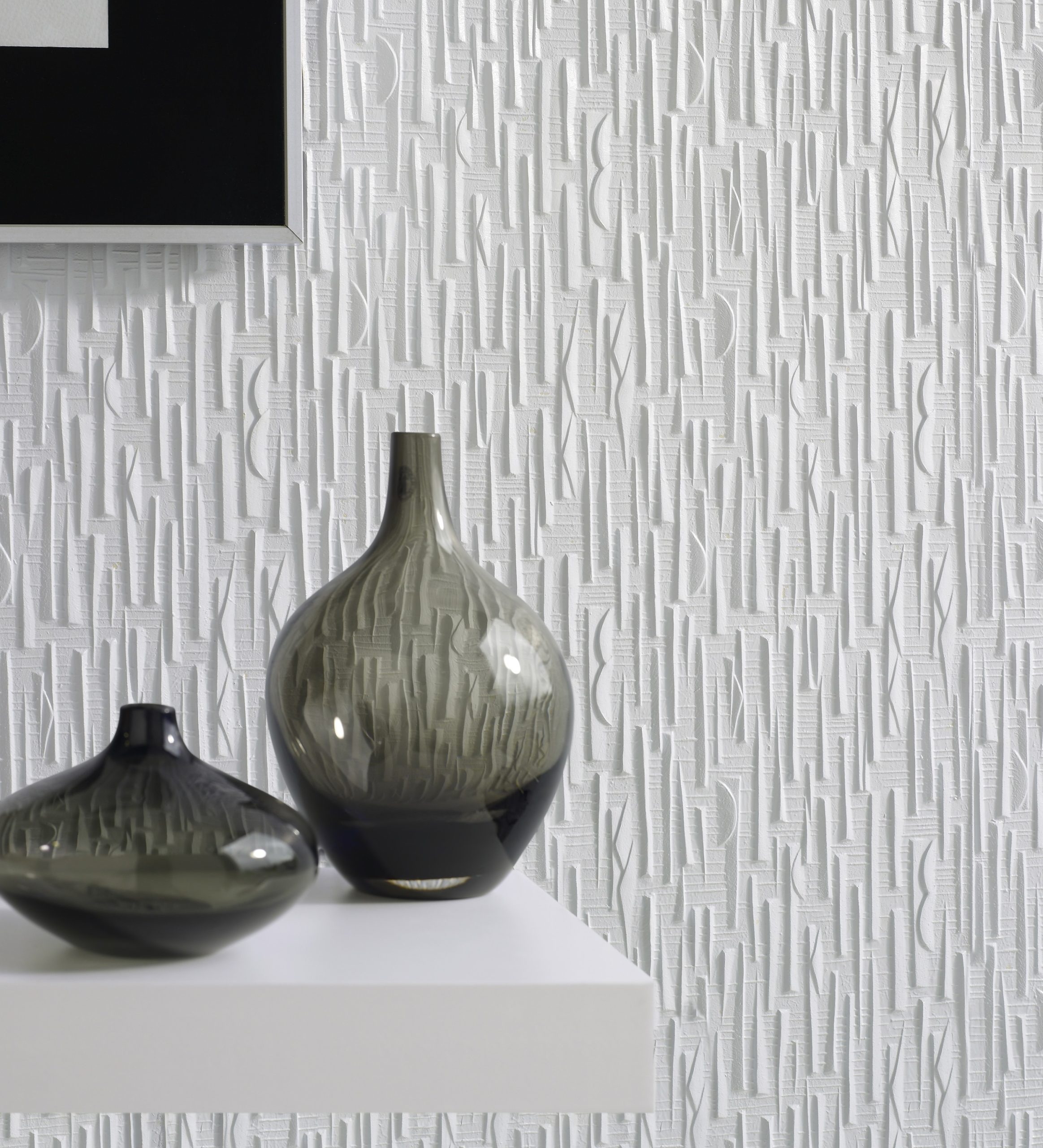 Lincrusta textured wallcovering with abstract vertical pattern in modern white interior