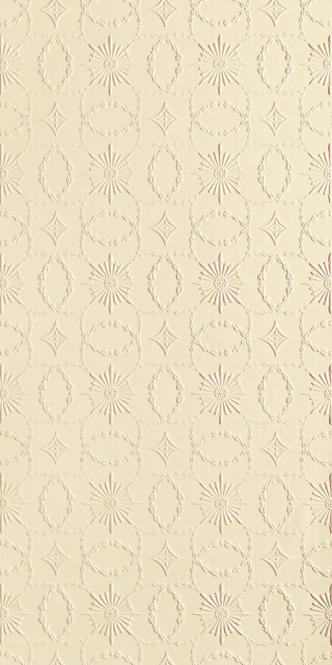 Lincrusta embossed geometric wallcovering with starburst and oval decorative motifs