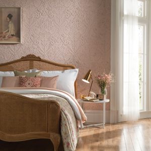 Lincrusta Ornamental Floral Wallcovering – Embossed Heritage Design Elegant bedroom featuring ornate pink Lincrusta wallcovering with embossed floral and bird detailing