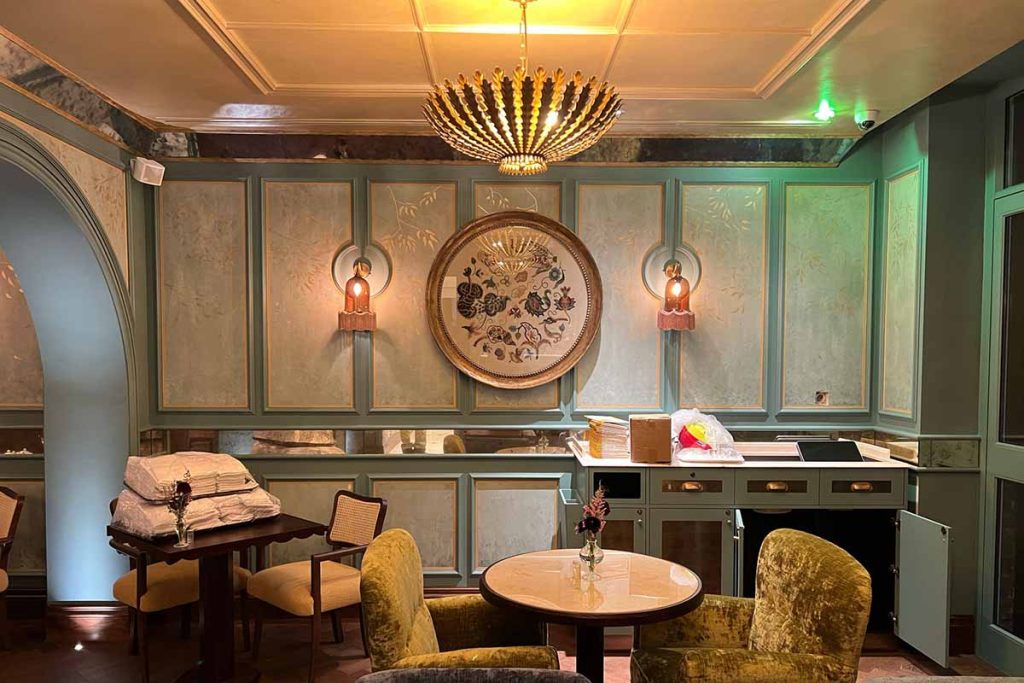 Bespoke decorative wall panelling and luxury interior detailing installed in Helena's Bar at The Sloane Club, London.