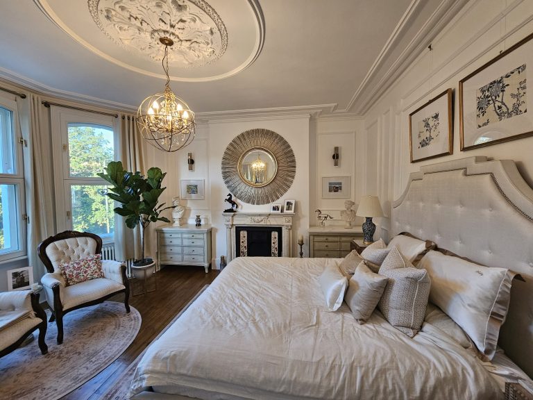 Victorian Cornice Company installation featuring handmade plaster cornice, decorative wall panelling and an ornate ceiling rose in a luxury bedroom.