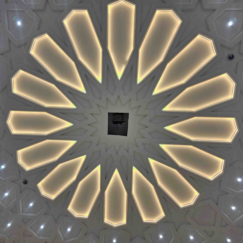 Completed geometric plaster ceiling design with integrated LED lighting at Birmingham Central Mosque