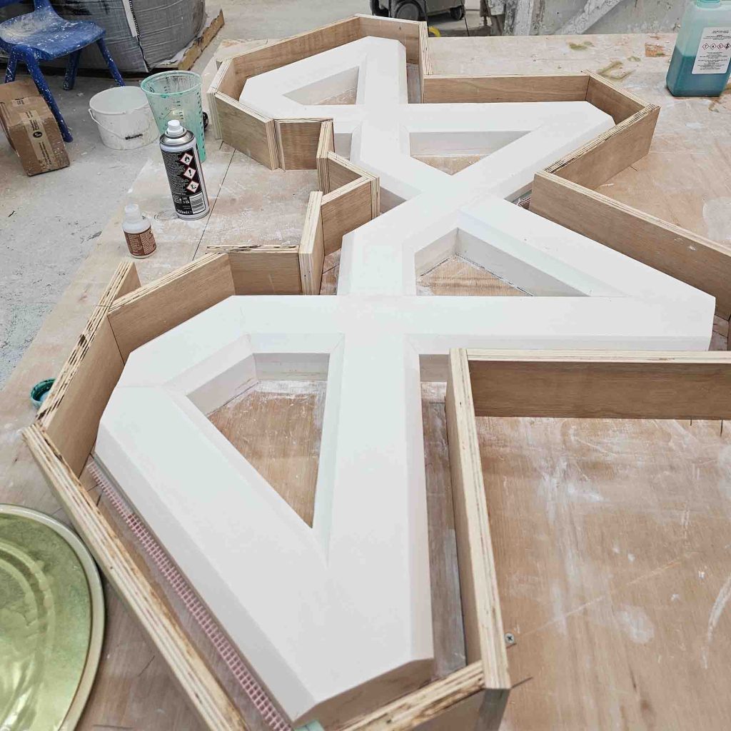 Plywood mould boxes being constructed around the plaster master shapes for Birmingham Central Mosque.